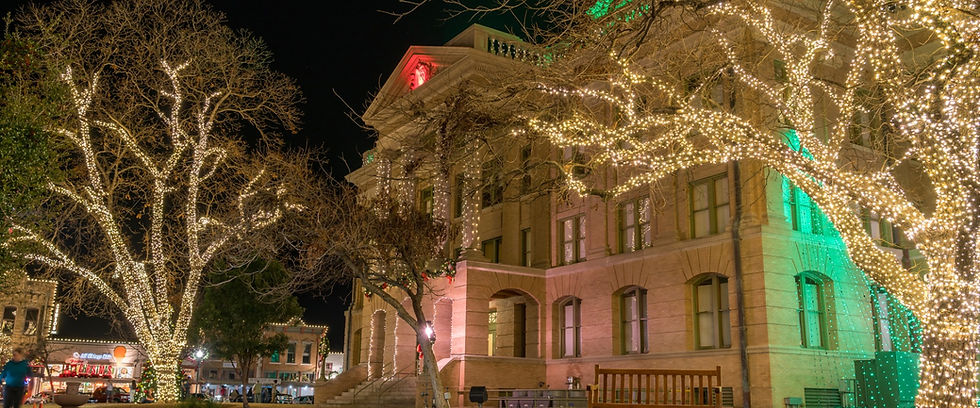 The Denton County Courthouse-on-the-Square lit up at night.
