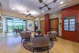 Lounge area with seating, coffee table, and patio view