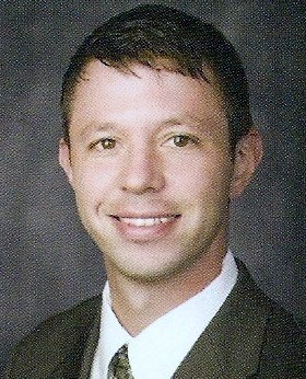 Smiling male associate in professional attire