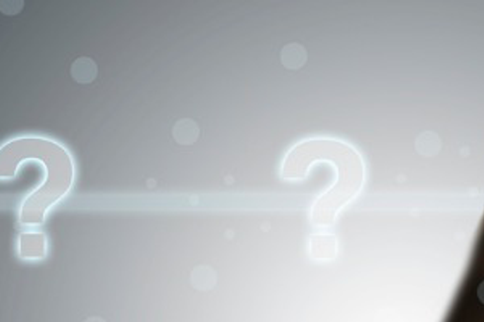 Woman pointing at floating question marks