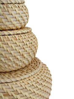 Stack of three woven wicker baskets
