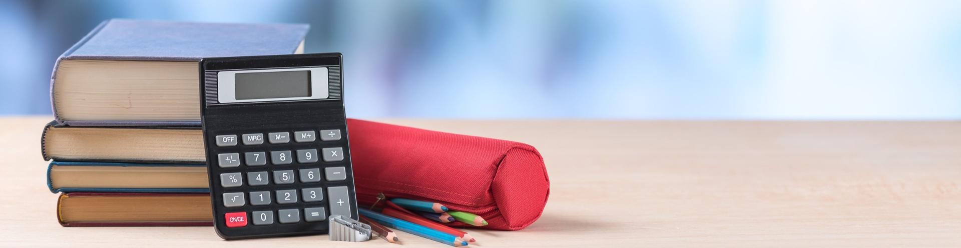 books pens on desk