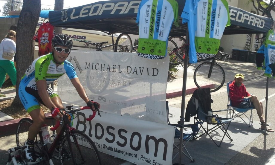 Cyclist at a Michael David Winery community event booth.