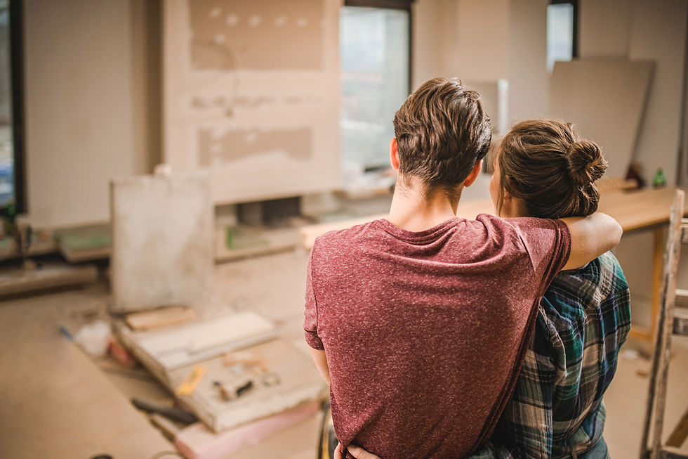 Couple overlooking a home renovation project