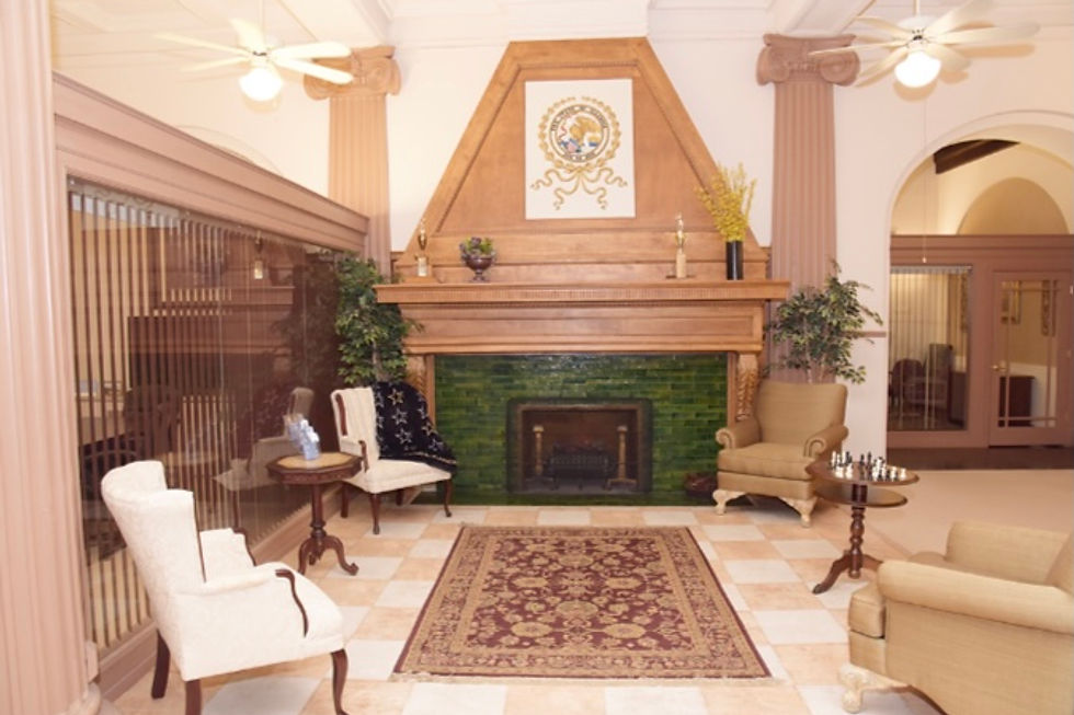 Elegant lounge with fireplace and traditional seating.