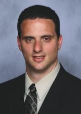Professional headshot of the organization's president.