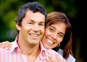 Smiling middle-aged couple outdoors