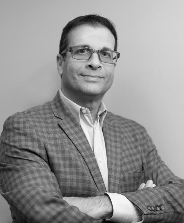 Professional man in a plaid blazer and glasses