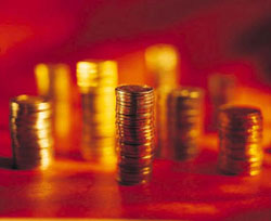 Stacks of gold coins representing Roth 401k savings.