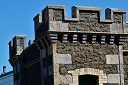 Stone battlements of an old castle tower