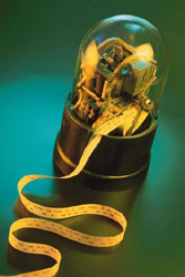 Vintage stock ticker machine with flowing paper tape