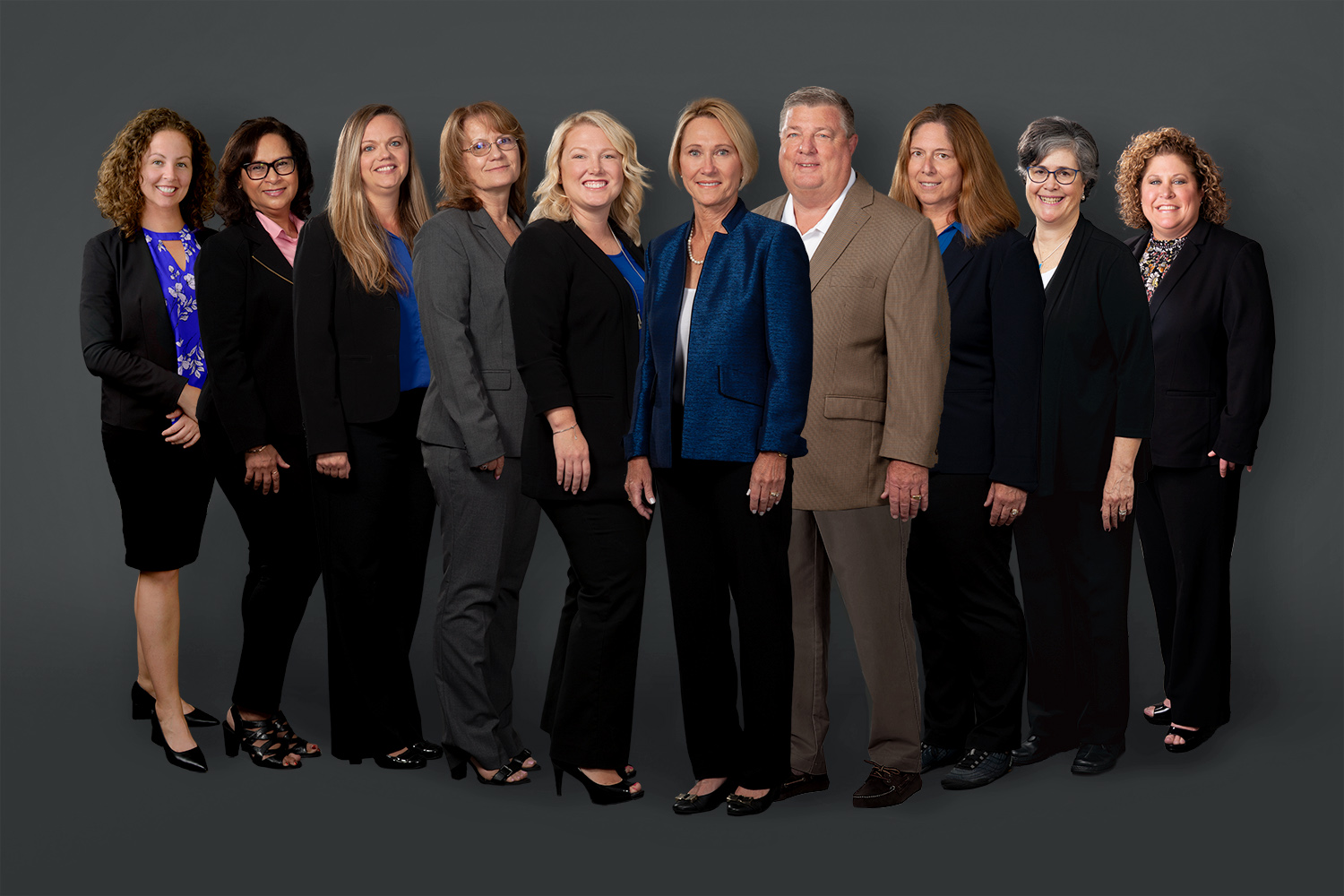 The professional team of our firm posing together.