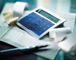 Calculator on top of receipts and financial documents