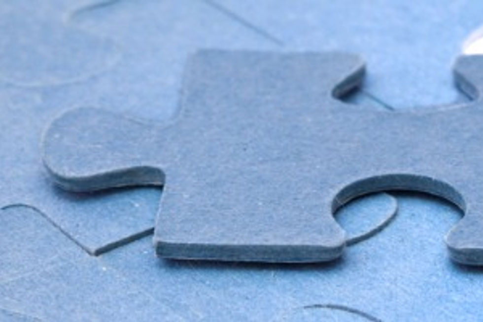 Single blue puzzle piece fitting into a gap