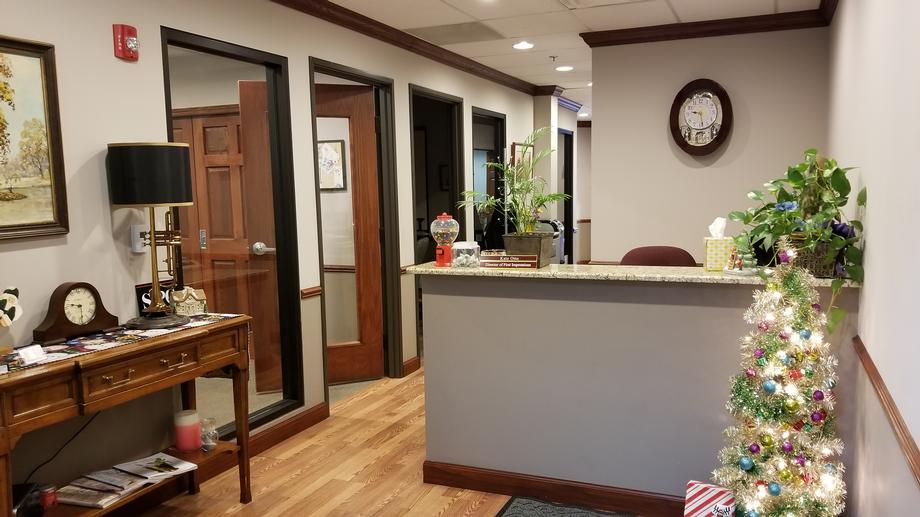 Modern office reception with seasonal Christmas tree
