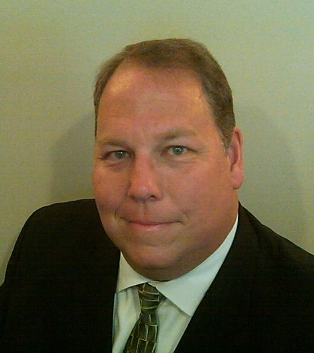 Portrait of a smiling man in a suit and tie