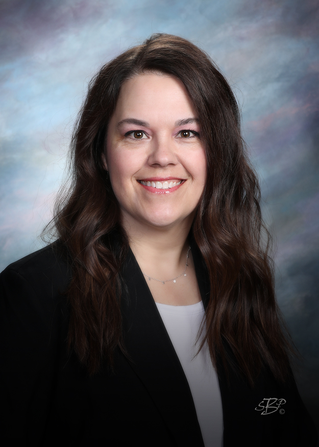 Smiling portrait of a woman from the TCB Insurance Team.