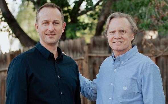 Don Leander and colleague smiling outdoors
