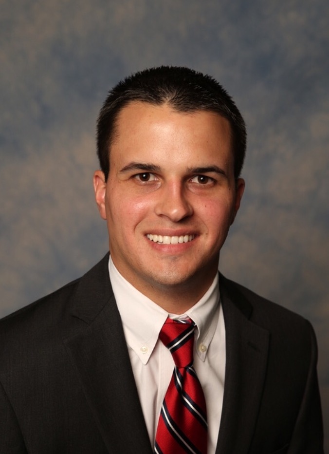 Smiling man in a suit for Custom Section 6