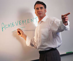 Professional writing achievement on white board while pointing