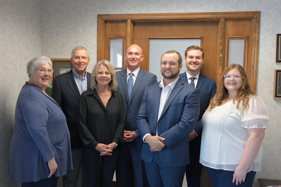 Professional team smiling in an office setting.