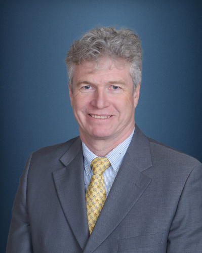Professional headshot of a male leadership member.