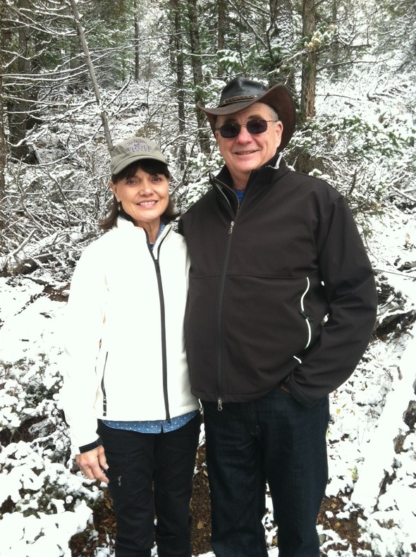 Smiling couple in a snowy forest