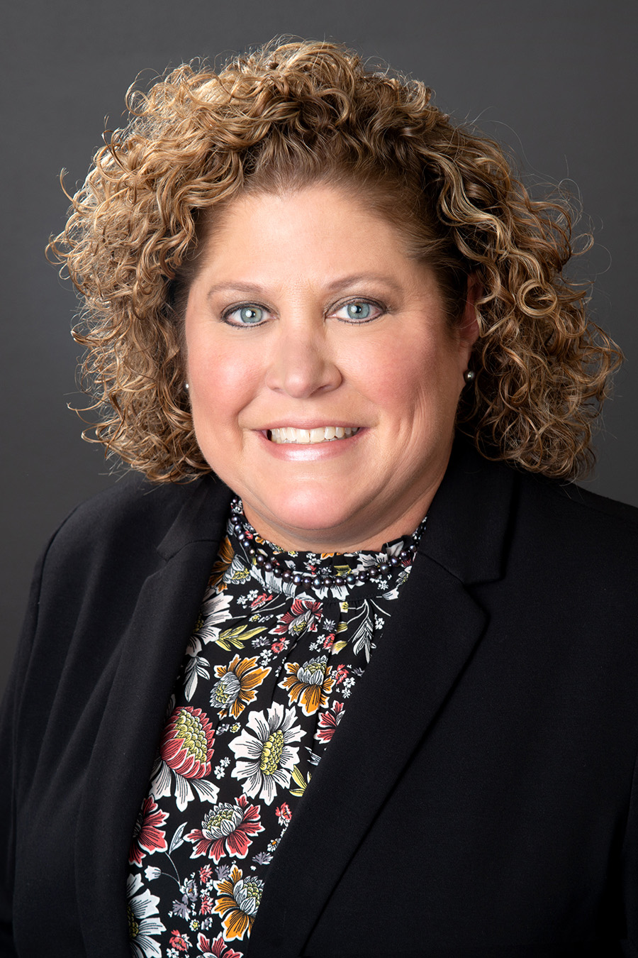 Professional headshot of PJ Haley smiling.