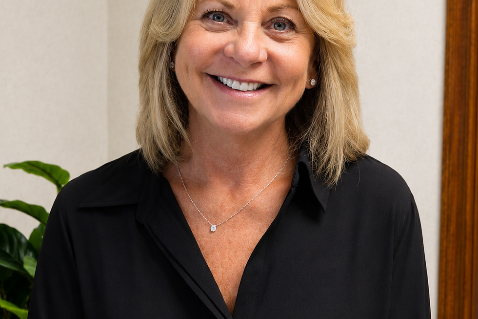 Smiling woman with blonde hair in a black blouse