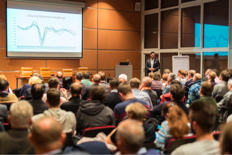 Audience attending an educational workshop presentation.
