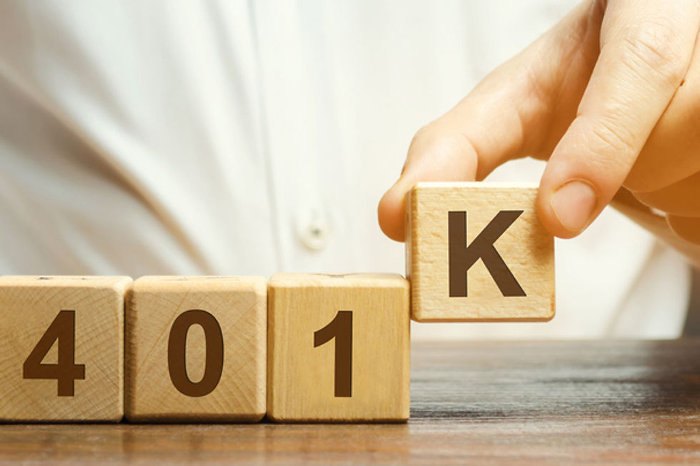 Hand placing a wooden block to complete the word 401K