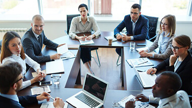 Diverse business team attending a workshop registration meeting.