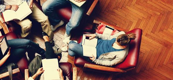 Students in a circle reading and studying together