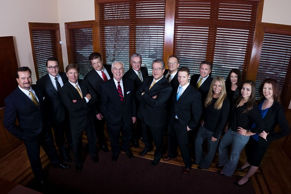 Professional team group portrait in a wood-trimmed office