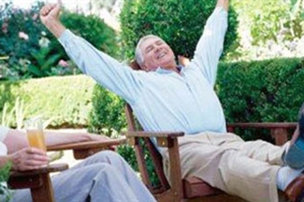 Happy retired man relaxing outdoors
