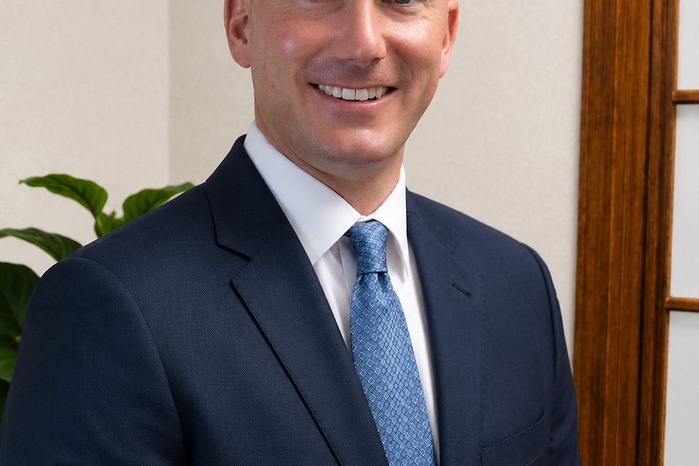 Chris Coffman in a professional suit and tie