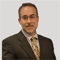 Professional headshot of a team member at Our Firm