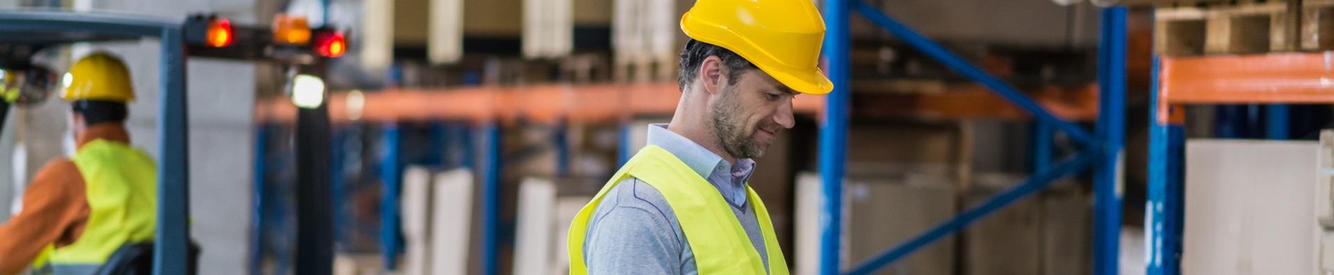 warehouse workers and fork truck