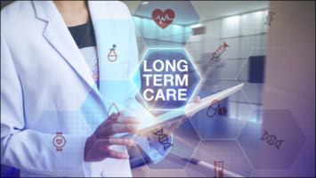 Healthcare professional holding a tablet with long term care text