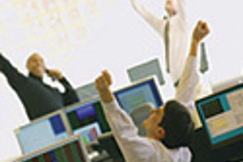 People celebrating success at computer screens