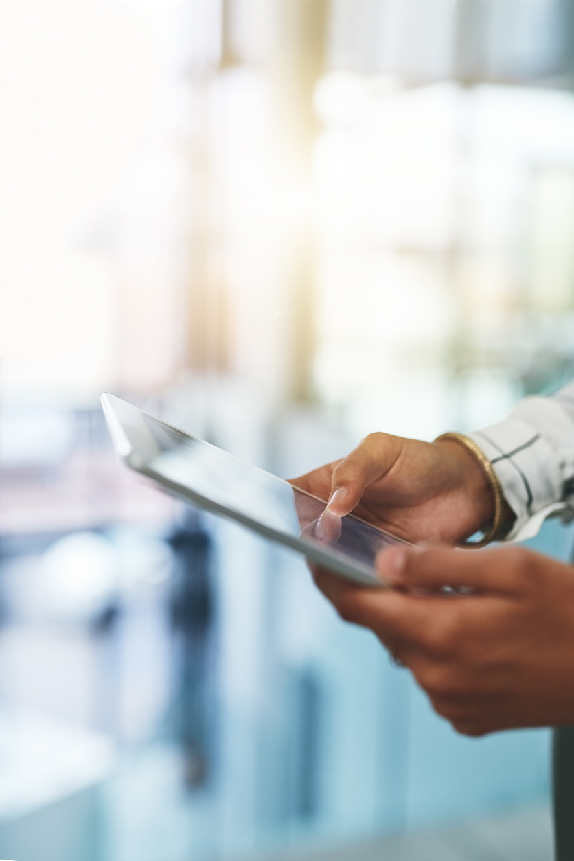 Person using a digital tablet for retirement planning