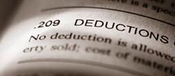 Close-up of income tax planning book text on deductions