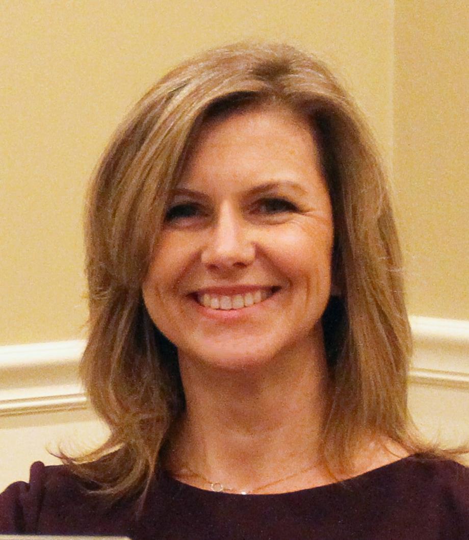 Smiling woman with shoulder-length blonde hair