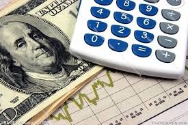 Calculator, dollar bill, and financial chart.