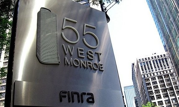 Building sign for 55 West Monroe featuring the FINRA logo.