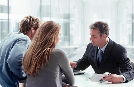 Professional consultant meeting with a young couple
