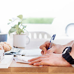 Person signing financial documents for NUA tax planning