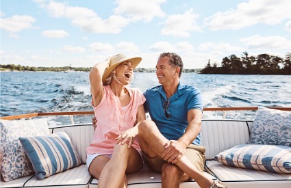 retired couple enjoying boating