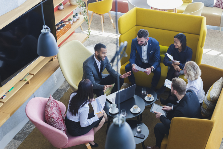 Diverse professionals in a retirement plan consulting meeting