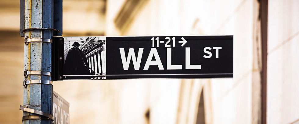 Wall Street sign with building graphic and arrow
